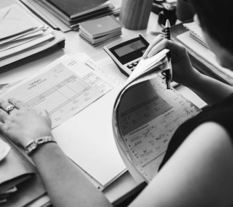 Asian woman working through paperwork